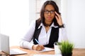 African american business woman is busy with paper job in office Royalty Free Stock Photo