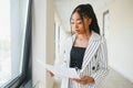 African american business woman standing, office hall with documents Royalty Free Stock Photo