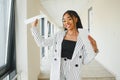 African american business woman standing, office hall with documents Royalty Free Stock Photo