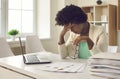 African-American business woman who is tired of work routines and deadlines suffers from headaches. Royalty Free Stock Photo