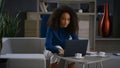 African american business woman writing notes calling phone in home office. Royalty Free Stock Photo