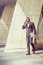 African American businessman talking on cell phone, walking out Royalty Free Stock Photo