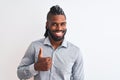 African american businessman with braids standing over isolated white background doing happy thumbs up gesture with hand Royalty Free Stock Photo