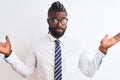 African american businessman with braids wearing tie glasses over isolated white background clueless and confused expression with Royalty Free Stock Photo