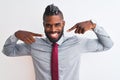 African american businessman with braids wearing tie standing over isolated white background smiling cheerful showing and pointing Royalty Free Stock Photo