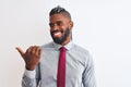 African american businessman with braids wearing tie standing over isolated white background smiling with happy face looking and Royalty Free Stock Photo