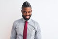 African american businessman with braids wearing tie standing over isolated white background winking looking at the camera with Royalty Free Stock Photo