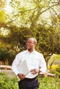 African american businessman carrying laptop