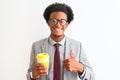 African american businessman drinking cup of coffee over isolated white background happy with big smile doing ok sign, thumb up Royalty Free Stock Photo