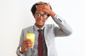 African american businessman drinking cup of coffee over isolated white background stressed with hand on head, shocked with shame