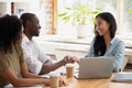 African businessman handshaking asian businesswoman thanking for good work