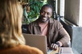 African American Businessman at Meeting in Cafe Royalty Free Stock Photo