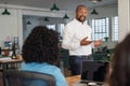 African American businessman meeting with his staff in an office Royalty Free Stock Photo