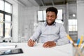 African american businessman with papers at office Royalty Free Stock Photo