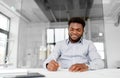 African american businessman with papers at office Royalty Free Stock Photo