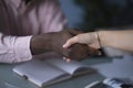 African American businessman shaking hands with caucasian businesswoman. Close up of African American man shaking hand Royalty Free Stock Photo