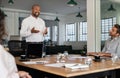 African American businessman smiling during a meeting with his staff Royalty Free Stock Photo