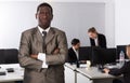 African American businessman standing at office near colleagues Royalty Free Stock Photo