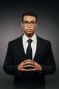African american businessman in suit and glasses on dark background Royalty Free Stock Photo