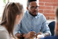 African American businessman talking with colleague at briefing Royalty Free Stock Photo