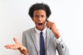 African american businessman talking on the smartphone over isolated white background very happy and excited, winner expression Royalty Free Stock Photo