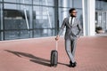 African American Businessman Traveler Standing With Suitcase Near Airport Outdoors