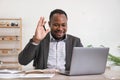 African American businessman using his laptop computer while working remotely from home. Online working or learning Royalty Free Stock Photo