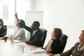 African-american businessman volunteer raising hand at corporate