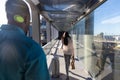 African american businessman walking behind businesswoman with luggage at airport corridor Royalty Free Stock Photo