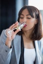 African american businesswoman drinking champagne from glass Royalty Free Stock Photo