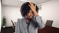 African American Businesswoman In an Office Making a Mistake