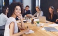 African-american businesswoman smiling at camera at meeting