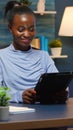 African american businesswoman taking break using tablet Royalty Free Stock Photo