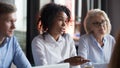 African American businesswoman talking with business partners at meeting Royalty Free Stock Photo