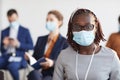 African American Businesswoman Wearing Mask at Conference Royalty Free Stock Photo