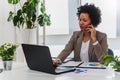 African american businesswoman working on computer at her office Royalty Free Stock Photo