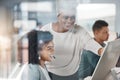 African american call centre telemarketing agent training new mixed race assistant on a computer in an office. Team Royalty Free Stock Photo