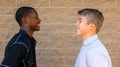 Black and White Teen Boys Smile at Each Other