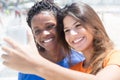 African american and caucasian girls taking photo Royalty Free Stock Photo