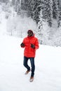African American Cheerful black man in ski suit in snowy winter outdoors, Almaty, Kazakhstan Royalty Free Stock Photo