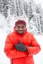 African American Cheerful black man in ski suit in snowy winter outdoors, Almaty, Kazakhstan Royalty Free Stock Photo