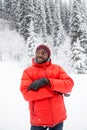 African American Cheerful black man in ski suit in snowy winter outdoors, Almaty, Kazakhstan Royalty Free Stock Photo