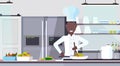 African american chef cooking dish male cook preparing food culinary concept modern commercial restaurant kitchen Royalty Free Stock Photo