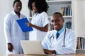African american chief physician with medical team Royalty Free Stock Photo
