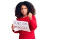 African american child with curly hair holding black lives matter banner annoyed and frustrated shouting with anger, yelling crazy