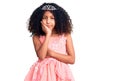 African american child with curly hair wearing princess crown thinking looking tired and bored with depression problems with