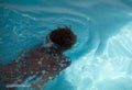 African American child with goggles in the pool Royalty Free Stock Photo