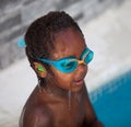 African American child with goggles in the pool Royalty Free Stock Photo