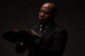 African American Christian Man Reading the Holy Scriptures, the Bible, The Word of God Royalty Free Stock Photo