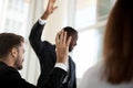 African American coach holding teambuilding meeting with colleagues